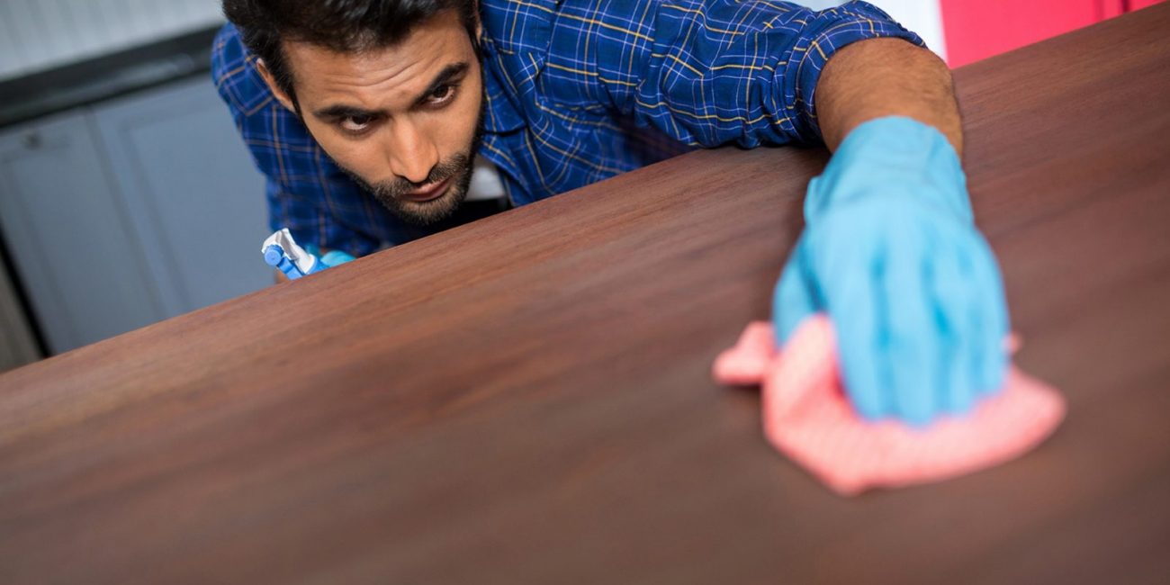 Man cleaning table Clean Freak