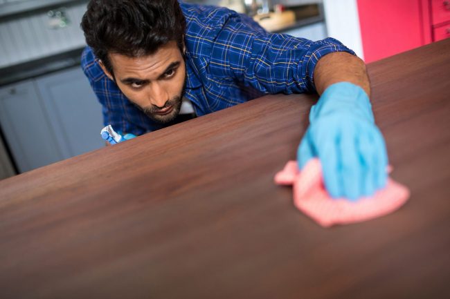 Man cleaning table Clean Freak